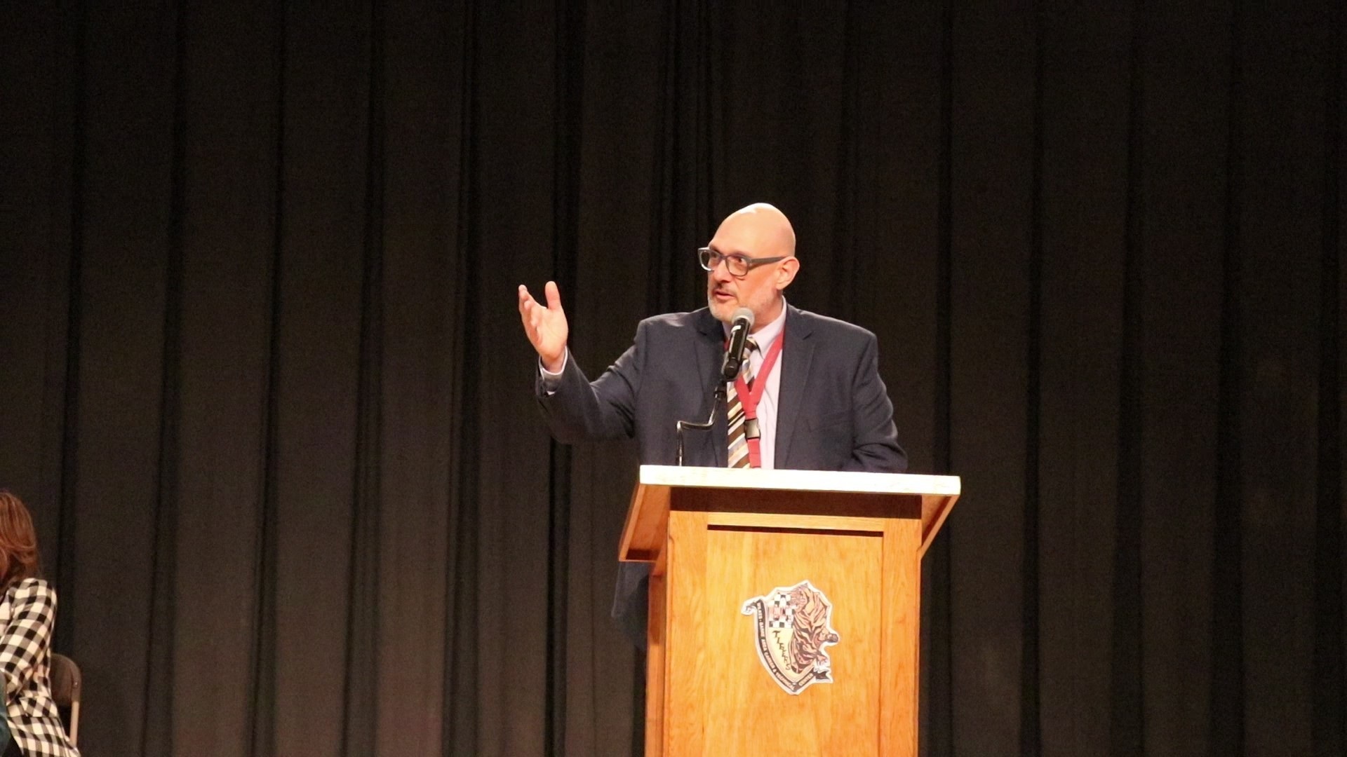 Tony Guariglia speaking at a podium